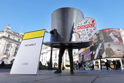 Giant Monopoly ‘top hat’ roams London’s streets to celebrate new 50p coins