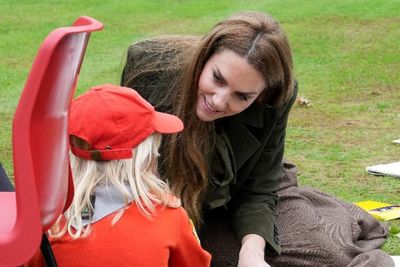 Kate and Melania share sweet moment with young Scouts on royal visit