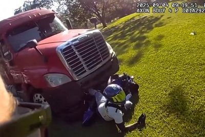 Fleeing suspect gets stuck under semi truck after speeding away from cops