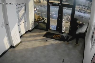 Moment Banksy burglar breaks into gallery and steals iconic £270,000 print off the wall