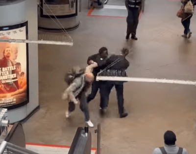 Watch: Shocking moment 'pickpocket' tackled by commuters in Canary Wharf before security urges them to 'relax'