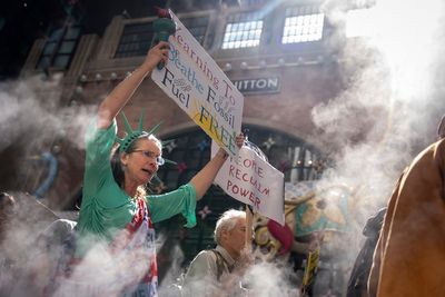 Marchers gather in worldwide protest of financial institutions "profiting off the climate crisis"