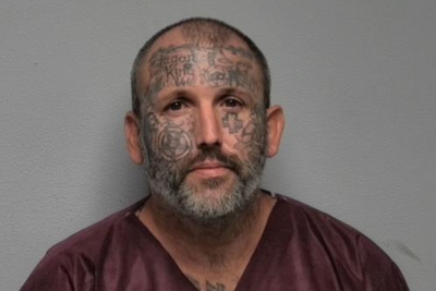 Tattoo-covered suspect accused of murdering mom and daughter served time for killing man and stuffing body in suitcase