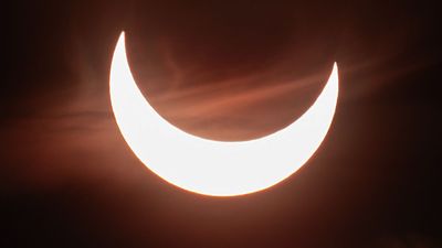 See the sun transform into a fiery crescent in breathtaking photos of the September 2025 partial solar eclipse