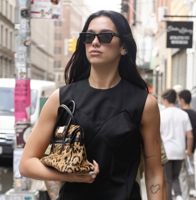 Dua Lipa Pairs a Leopard Margiela Bag With a $50,000 Diamond Ring and Taylor Swift's Favorite Cartier Watch