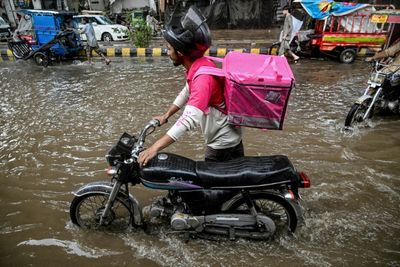 No Pause For Food Delivery Riders During Pakistan's Monsoon