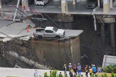Huge sinkhole near hospital swallows cars and sparks traffic chaos