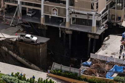 Watch: Massive sinkhole swallows Bangkok street as residents flee in panic