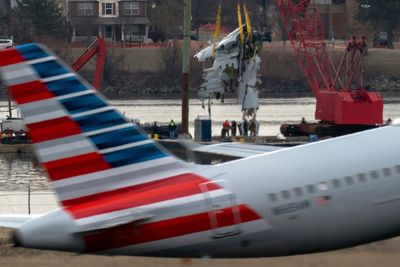 Family of 1 of the 67 Washington plane crash victims sues the FAA, Army and American Airlines