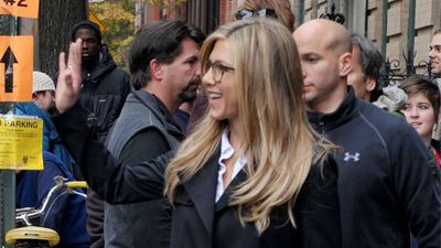 Every autumn wardrobe should include a classic trench coat and a pair of timeless knee boots - Jennifer Aniston's look proves it