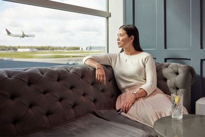 What is Priority Pass and how can I get lounge access?