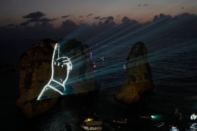 Hezbollah defies Lebanon PM's ban to honor fallen leaders with coastal light show