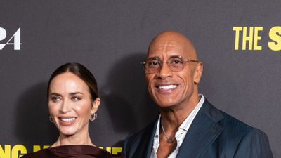 Emily Blunt’s Cool Berlin Mini Dress Proves Brown Is In For Fall (And I Hope These Thumbholes Are In, Too)
