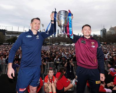 Party animals, kick-to-kick and Zeus: AFL grand final parade adds splash of colour under grey skies