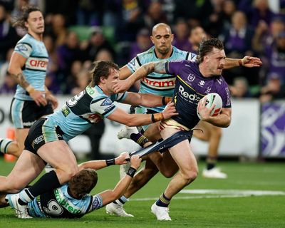 Munster and Hughes masterclass takes Storm past Sharks and into grand final