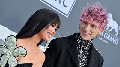 Machine Gun Kelly’s Photo Dump Includes A Photo Of His And Megan Fox’s Baby (And Her Onesie Is So On Brand)