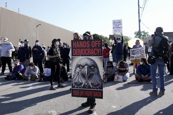 Federal agents fire chemicals as protesters try to block car at immigration site outside Chicago