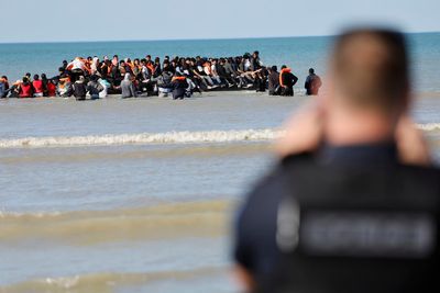 Single boat carrying record 125 migrants crosses Channel to UK