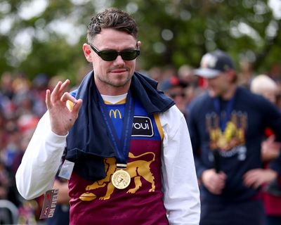 Lions coach hails AFL premiership as ‘better than last year’ as Cats lick wounds