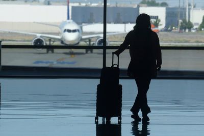 Some air travelers bothered by their flight's emissions turn to carbon offsets. Do they work?