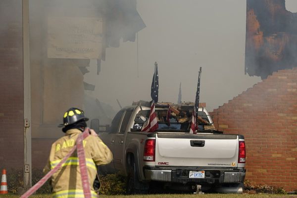 Police remain on scene at burned out Michigan church after shooting and fire leave 4 dead, 8 wounded