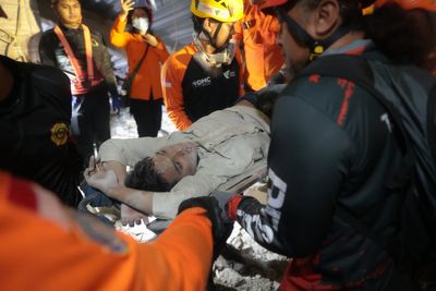 Photos from the collapse of an Islamic school building in Indonesia