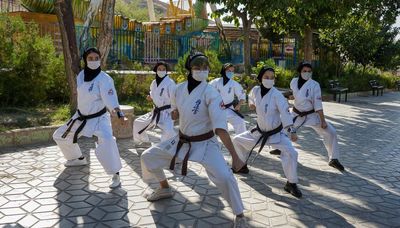 ‘It’s more than martial arts – we teach courage‘: the Afghan sisters honing karate skills in Iran