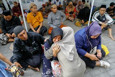 Three dead and dozens trapped under rubble after Indonesia school collapse