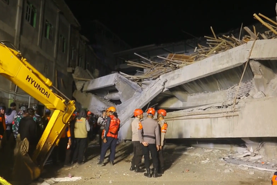 Dozens trapped in deadly Indonesian school collapse as rescuers search for survivors