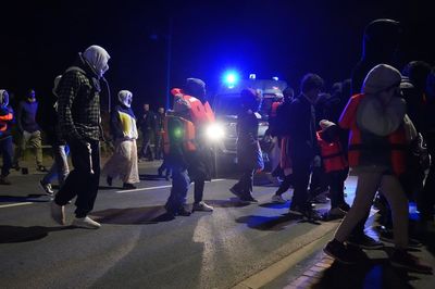 Riot police stop migrants from reaching beach in French town