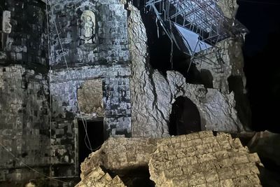 Strong earthquake in central Philippines damages building and sends people out of their homes