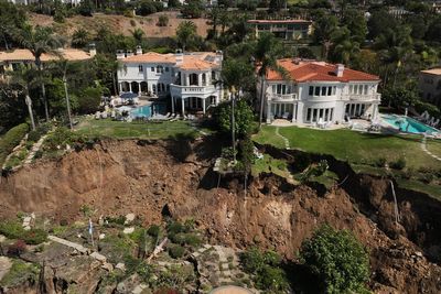 Hundreds of feet of coastal bluff in California fell toward the ocean in landslide-stricken town