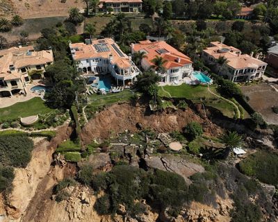 Photos show bluff crumbling towards ocean in landslide-stricken California enclave