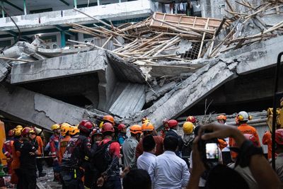 Indonesia school collapse: 91 missing and three dead as rescuers search rubble for second day
