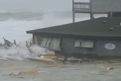 Beachfront homes collapse into the sea as hurricanes batter US coast