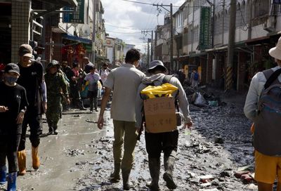 Gym bros, monks, retirees: thousands descend on Taiwan town to clean up after devastating flood