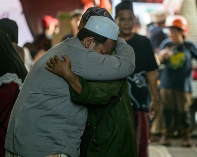 No apology and no answers: parents in agony amid search for children trapped in Indonesia school collapse