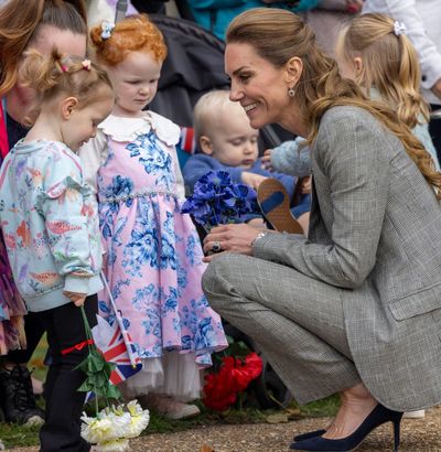 Princess Kate Brings Boardroom Basics to a Royal Air Force Base—And Shares a Sweet Fashion Moment With a Young Fan