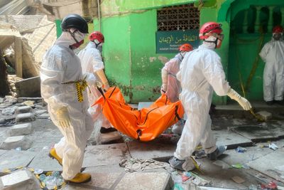 Indonesian crews pull 3 bodies from rubble of collapsed school with more than 50 boys still missing