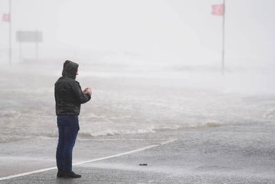 Busy city centre road closed after building collapses on to car amid Storm Amy