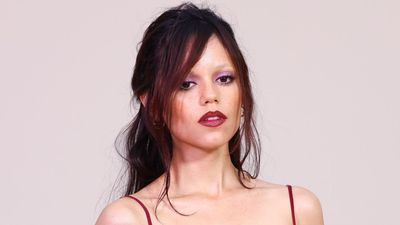 Jenna Ortega Turned Heads In Sheerly Remarkable Red Dress, But It Was The Cost Of Her Fashion Week Jewelry That Had Me Reeling