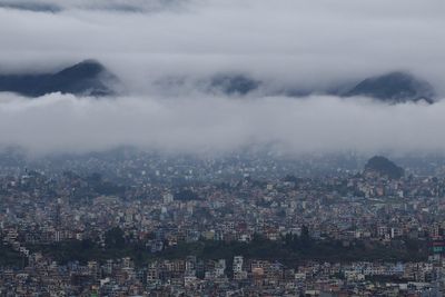 Six members of family killed after landslide buries home as heavy rains cause flooding in Nepal