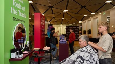 Social media ban trims budding young barber's following