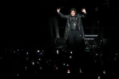 Argentine President roars his way through rock concert after $20bn bail out from the US