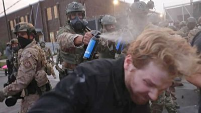 ‘So much for Christian values’: ICE agent caught firing a pepper ball on an unarmed priest in Chicago