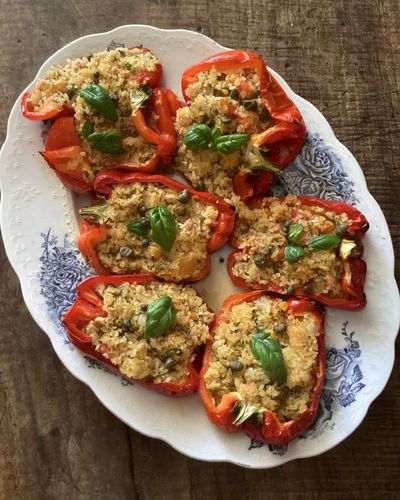 Rachel Roddy’s recipe for red peppers stuffed with orzo, tuna, capers and herbs