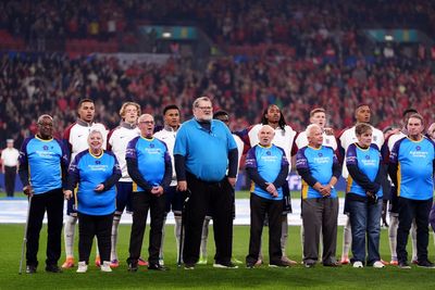 Football fans with dementia walk out with players for England-Wales match