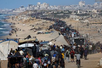 Israel says Gaza ceasefire has begun as troops pull back and thousands of Palestinians return home