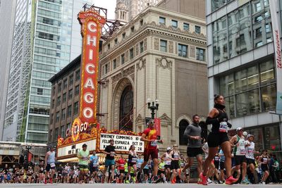 Fear and loathing on the marathon trail: Tensions high as thousands of runners flock to Chicago race with ICE roving streets