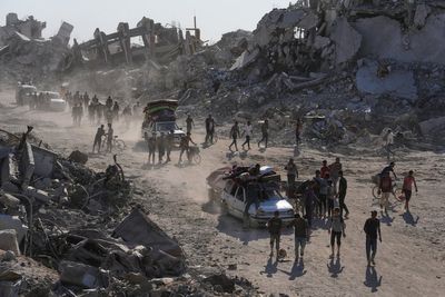Some Palestinians pack up and move north toward their homes in Gaza after ceasefire goes into effect